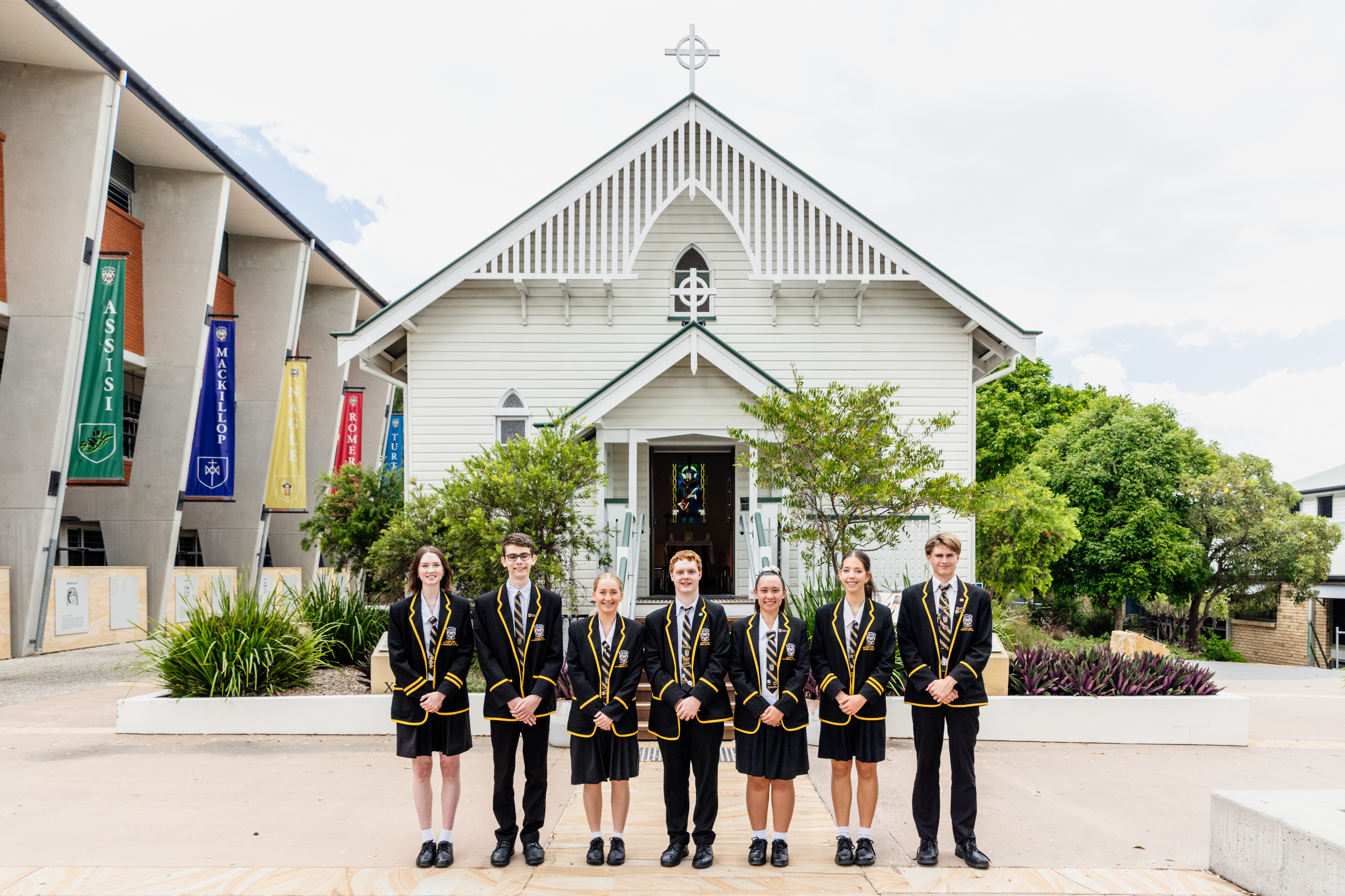 Students standing in one line outside STMC Chapel