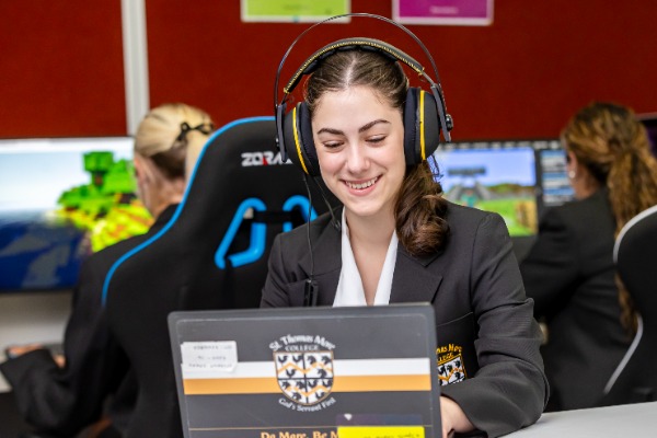 Students playing e-sports games with headsets on 