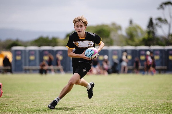 stmc male student playing touch football.jpg