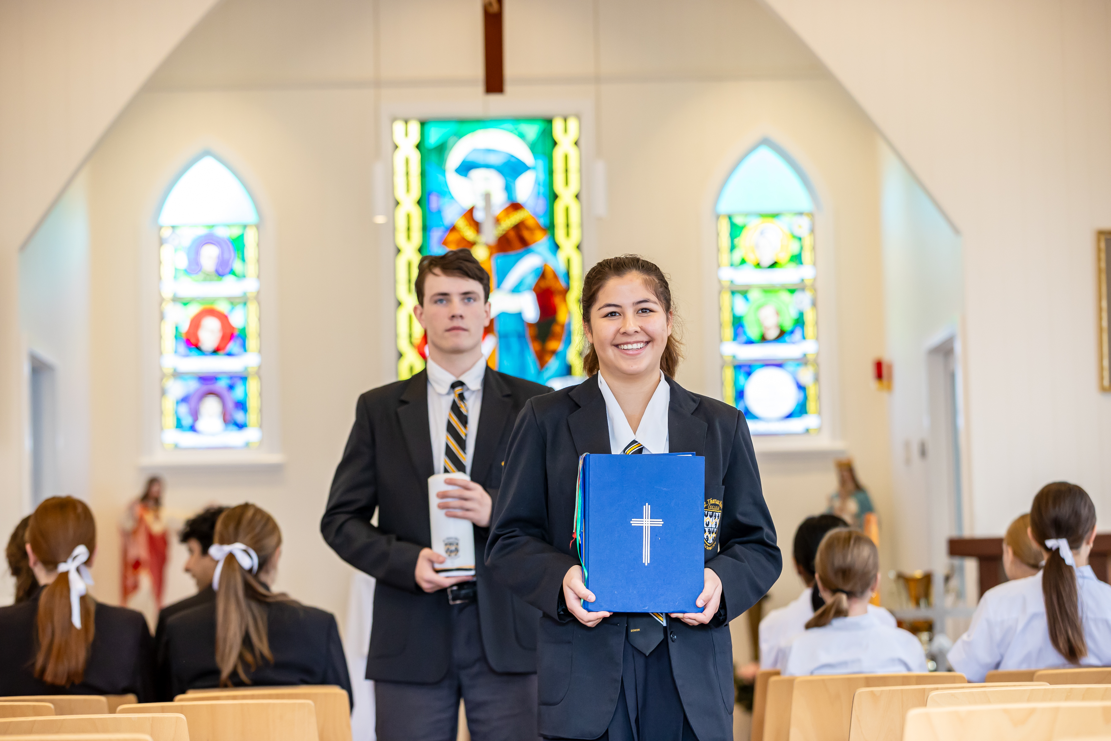 students participating in a liturgical celebration inside the school chapel, reflecting faith formation, student leadership and shared worship
