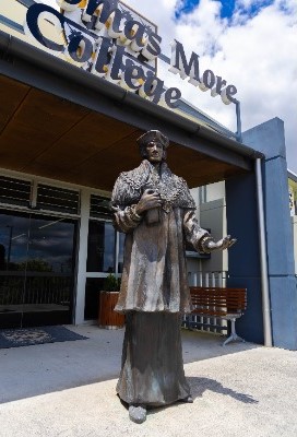 statue of Saint Thomas More at the college entrance, representing faith, tradition and school identity