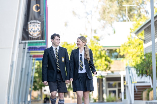 students walking together through the school grounds in uniform, representing student life, connection and a welcoming school community