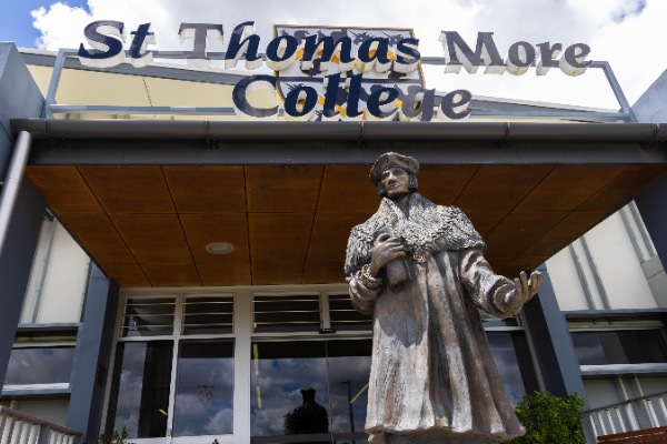 front reception with stmc sign and st thomas more statue