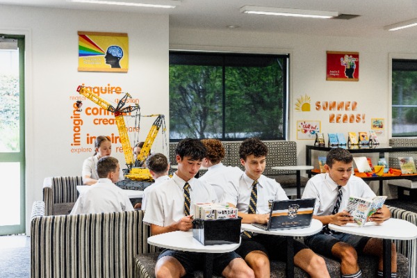 students reading and working in a flexible library learning space, highlighting independent study, collaboration and a culture of learning